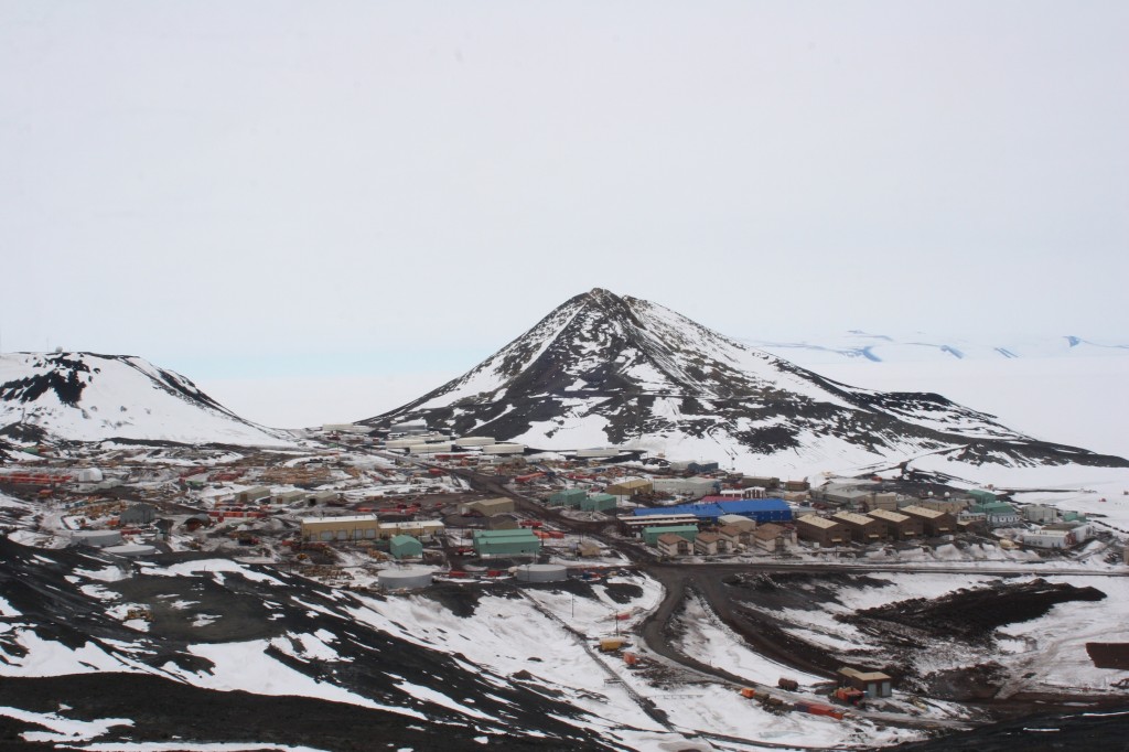 Another view of McMurdo Station, with Obs Hill in the background.  The brown buildings on the right middle are the dorms, while the blue building houses the galley (as well as dorms and some administrative offices).